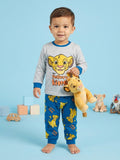 Child wearing The Lion King-themed pajamas holding a plush toy on a blue background